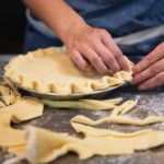 hands making pie crust