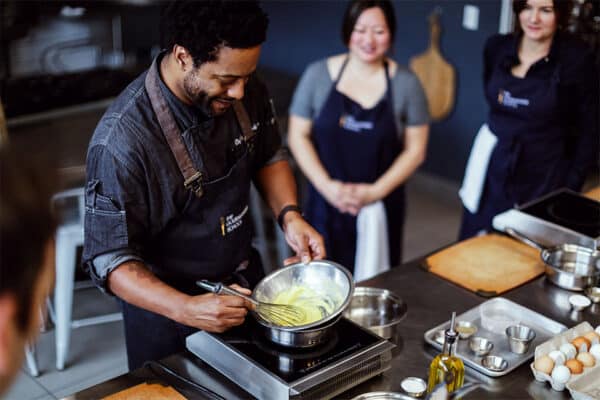 Chef demonstrating sauce-making at The Gourmandise School